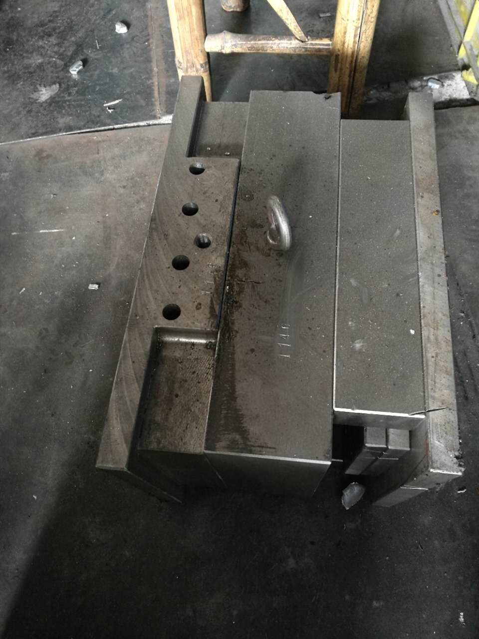 A filled mold for tooling for die casting parts.