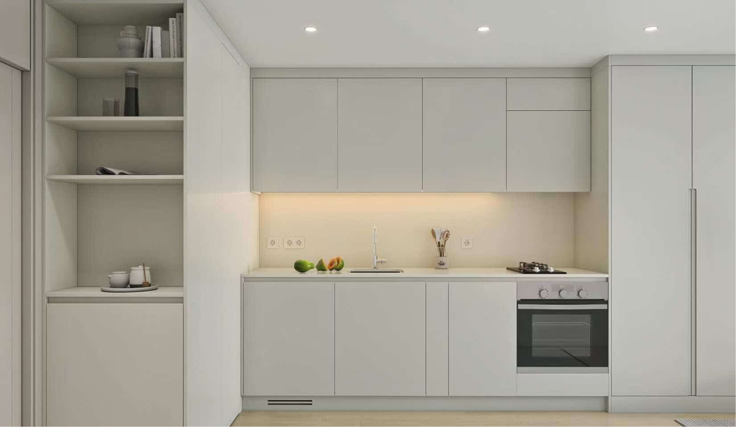 Sleek modern kitchen with clean white cabinetry, built-in shelves, a stainless steel oven, and a minimalist design with a soft under-cabinet light.