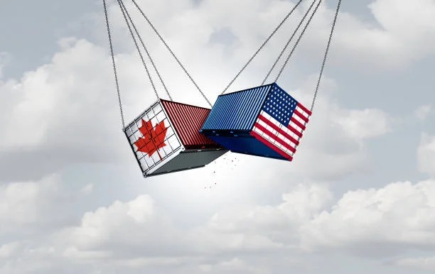 Two shipping containers, one representing Canada and the other representing America, clashing against each other.